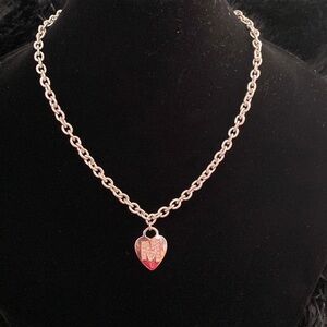 Silver necklace with a heart and the letter M with pink zircons